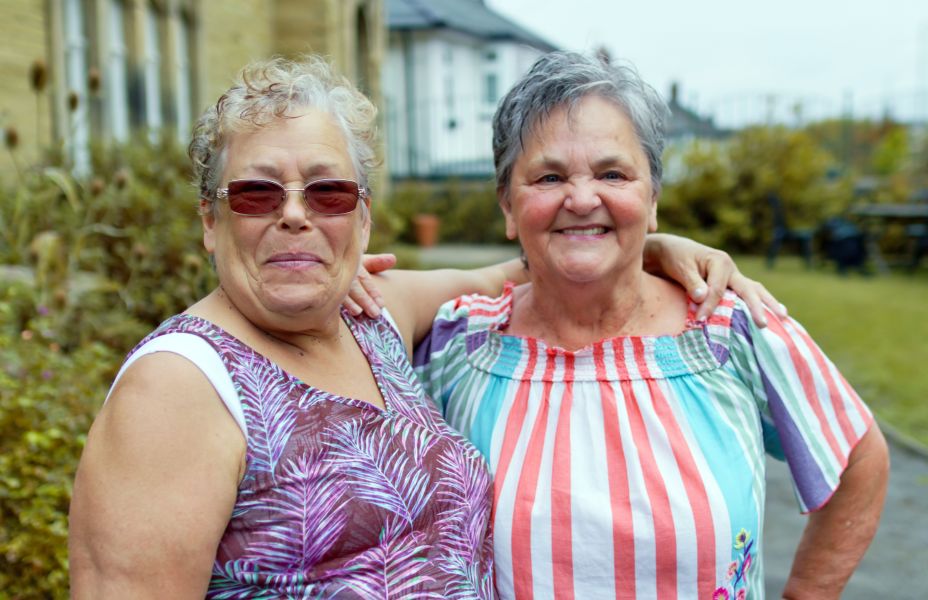 Photo of 2 adults embracing